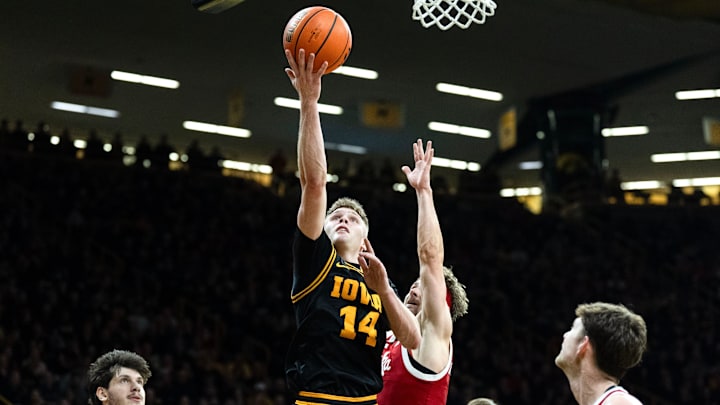Iowa guard Bennett Stirtz (14) drives to the basket against the Nebraska Cornhuskers Feb. 17, 2026 at Carver-Hawkeye Arena in Iowa City, Iowa. Iowa guard Bennett Stirtz (14) drives to the basket against the Nebraska Cornhuskers Feb. 17, 2026 at Carver-Hawkeye Arena in Iowa City, Iowa.