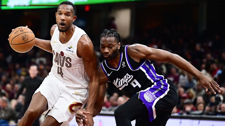 Jan 23, 2026; Cleveland, Ohio, USA; Cleveland Cavaliers center Evan Mobley (4) drives to the basket against Sacramento Kings forward Precious Achiuwa (9) during the second half at Rocket Arena. Mandatory Credit: Ken Blaze-Imagn Images