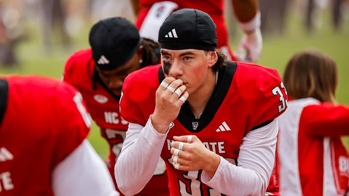 Oct 10, 2026; Raleigh, North Carolina, USA;  NC State Wolfpack linebacker Nathan Huffman (33) prays prior to the first half of the game against Wake Forest Demon Deacons at Carter-Finley Stadium.  Mandatory Credit: Jaylynn Nash-Imagn Images