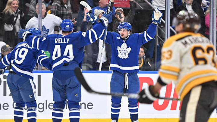 Dec 2, 2023; Toronto, Ontario, CAN; Toronto Maple Leafs forward Auston Matthews (34) celebrates with teammates Morgan Rielly (44) and Calle Jarnkrok (19) after a Leafs goal.