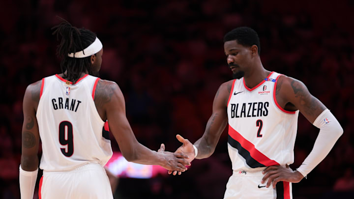 Jan 21, 2025; Miami, Florida, USA; Portland Trail Blazers center Deandre Ayton (2) shakes hands with forward Jerami Grant (9) before the third quarter against the Miami Heat at Kaseya Center. Mandatory Credit: Sam Navarro-Imagn Images