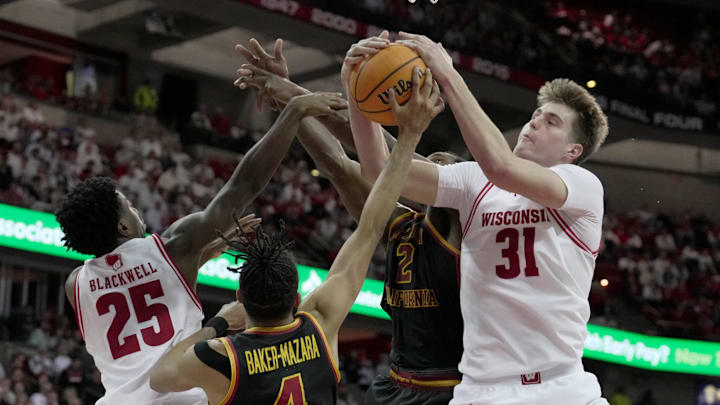 Wisconsin forward Nolan Winter (31) competes again USC forward Chad Baker-Mazara (4) and guard EJ Neal (12) during the second half of their game Sunday, January 25, 2026 at the Kohl Center in Madison, Wisconsin. USC beat Wisconsin 73-71.