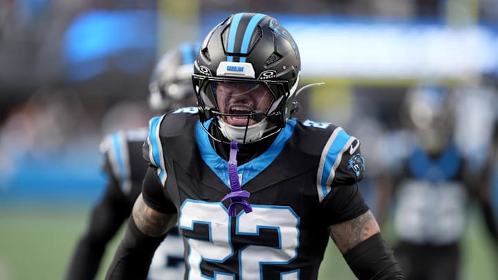 Dec 21, 2025; Charlotte, North Carolina, USA;  Carolina Panthers safety Lathan Ransom (22) celebrates the game-winning interception against the Tampa Bay Buccaneers during the second half at Bank of America Stadium. Mandatory Credit: Jim Dedmon-Imagn Images