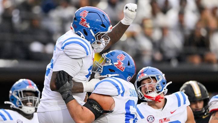 Oct 10, 2026; Nashville, Tennessee, USA;  Mississippi Rebels defensive tackle Jamarious Brown (96) celebrates his touchdown catch against the Vanderbilt Commodores during the first half at FirstBank Stadium.  Mandatory Credit: Steve Roberts-Imagn Images
