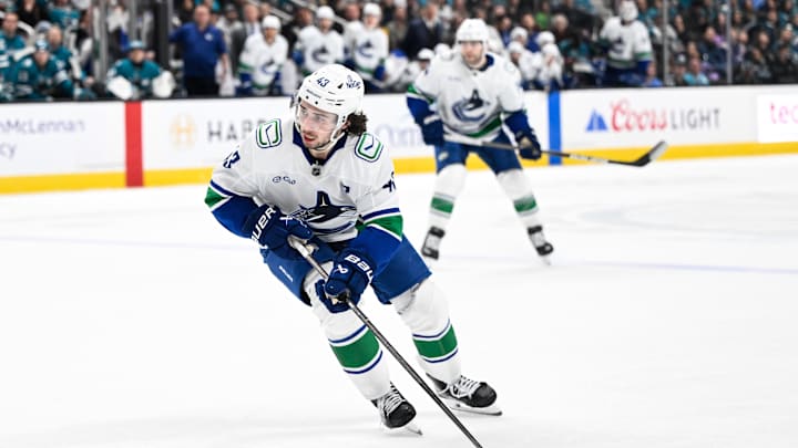 Nov 28, 2025; San Jose, California, USA; Vancouver Canucks defenseman Quinn Hughes (43) controls the puck against the San Jose Sharks in the third period at SAP Center at San Jose. Mandatory Credit: Eakin Howard-Imagn Images Nov 28, 2025; San Jose, California, USA; Vancouver Canucks defenseman Quinn Hughes (43) controls the puck against the San Jose Sharks in the third period at SAP Center at San Jose. Mandatory Credit: Eakin Howard-Imagn Images