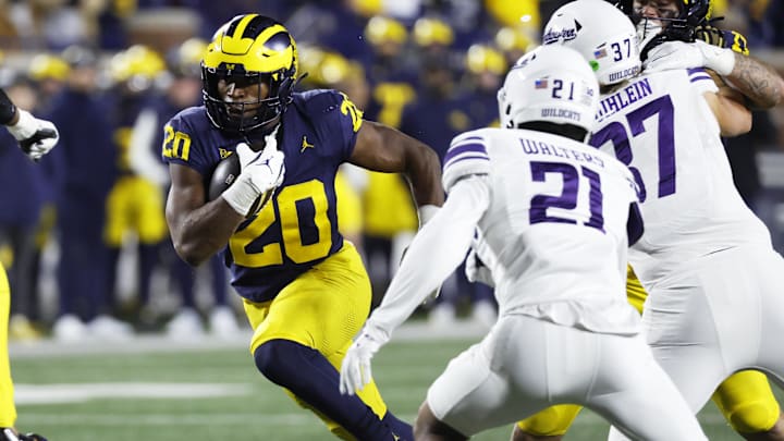 Nov 23, 2024; Ann Arbor, Michigan, USA;  Michigan Wolverines running back Kalel Mullings (20) runs the ball against the Northwestern Wildcats in the second half at Michigan Stadium. Mandatory Credit: Rick Osentoski-Imagn Images