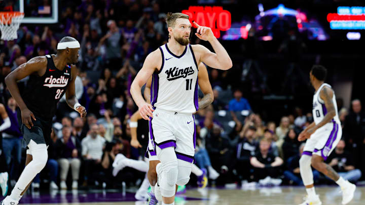 Mar 27, 2025; Sacramento, California, USA; Sacramento Kings forward Domantas Sabonis (11) celebrates after a play during the third quarter against the Portland Trail Blazers at Golden 1 Center. Mandatory Credit: Sergio Estrada-Imagn Images