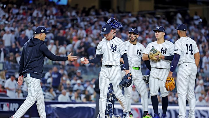 Sep 30, 2025; Bronx, New York, USA; New York Yankees manager Aaron Boone (17) takes out New York Yankees pitcher Luke Weaver (30) during the seventh inning against the Boston Red Sox during game one of the Wildcard round for the 2025 MLB playoffs at Yankee Stadium. Mandatory Credit: Brad Penner-Imagn Images