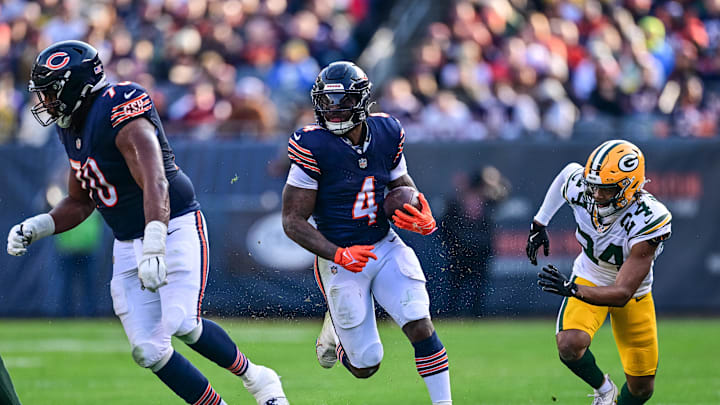 Nov 17, 2024; Chicago, Illinois, USA; Chicago Bears running back D'Andre Swift (4) runs for a 39 yard touchdown against the Green Bay Packers during the third quarter at Soldier Field. Mandatory Credit: Daniel Bartel-Imagn Images