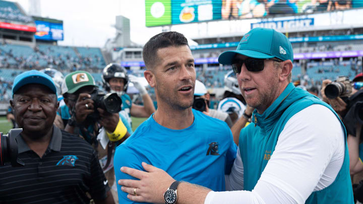 Carolina Panthers head coach Dave Canales and Carolina Panthers head coach Liam Coen met at the center of the field after the game between the Carolina Panthers at Jacksonville Jaguars at EverBank Stadium Sunday September 7, 2025. Jaguars defeated the Panthers 26-10. [Doug Engle/Florida Times-Union]