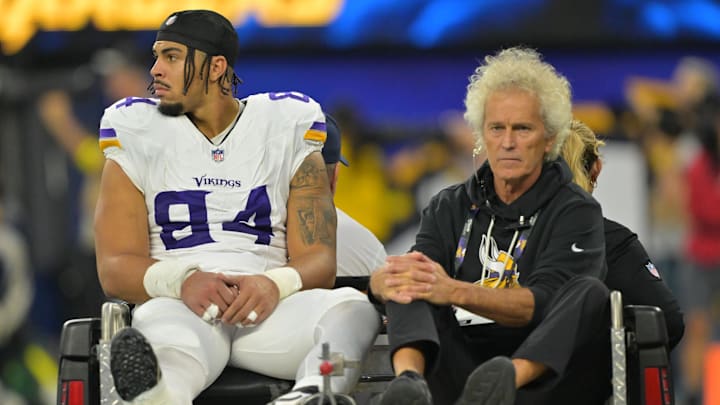 Oct 23, 2025; Inglewood, California, USA; Minnesota Vikings tight end Josh Oliver (84) is carted off the field after an injury against the Los Angeles Chargers during the first half at SoFi Stadium. Oct 23, 2025; Inglewood, California, USA; Minnesota Vikings tight end Josh Oliver (84) is carted off the field after an injury against the Los Angeles Chargers during the first half at SoFi Stadium.