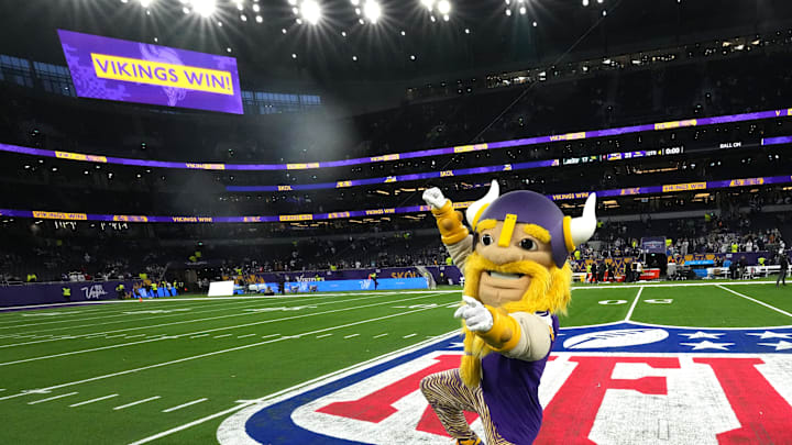 Oct 6, 2024; London, United Kingdom; Minnesota Vikings mascot Viktor poses on the NFL shield logo after the game against the New York Jets at Tottenham Hotspur Stadium. Mandatory Credit: Kirby Lee-Imagn Images