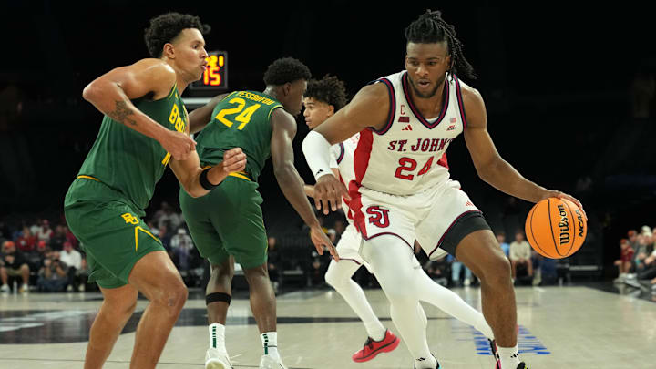 Nov 25, 2025; Las Vegas, Nevada, USA; St. John's Red Storm forward Zuby Ejiofor (24) dribbles the ball against Baylor Bears guard Michael Rataj (12) in a 2025 Players Era Festival group play game at Michelob Ultra Arena. Mandatory Credit: Kirby Lee-Imagn Images