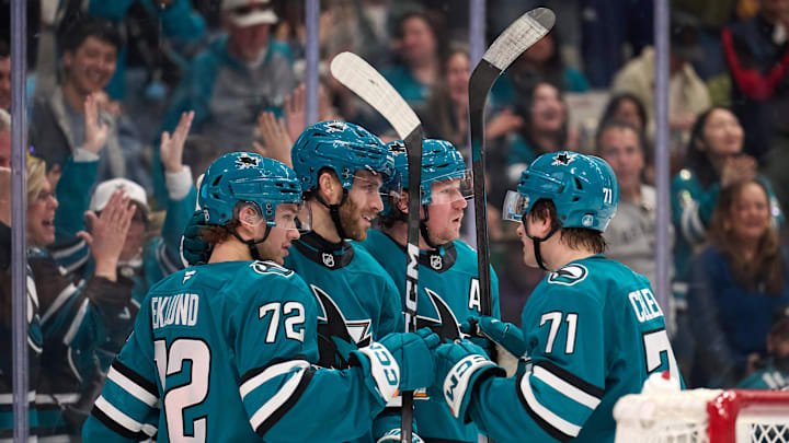 Jan 10, 2026; San Jose, California, USA; San Jose Sharks center Alexander Wennberg (21) celebrates with left wing William Eklund (72), center Tyler Toffoli (73) and center Macklin Celebrini (71) after scoring a goal during the second period at SAP Center at San Jose. Mandatory Credit: Robert Edwards-Imagn Images