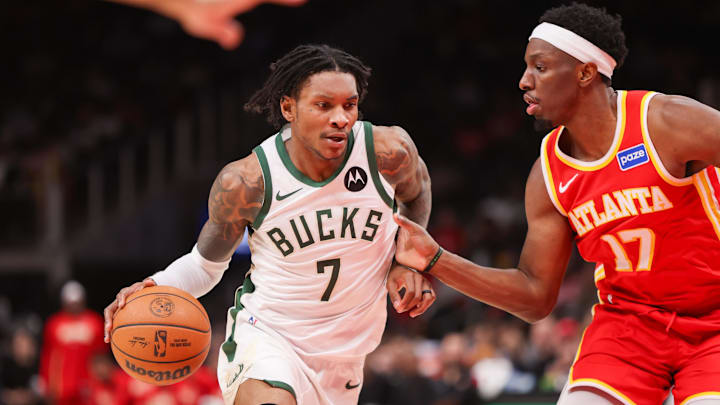 Mar 14, 2026; Atlanta, Georgia, USA; Milwaukee Bucks guard Kevin Porter Jr. (7) drives on Atlanta Hawks forward Onyeka Okongwu (17) in the second quarter at State Farm Arena. Mandatory Credit: Brett Davis-Imagn Images