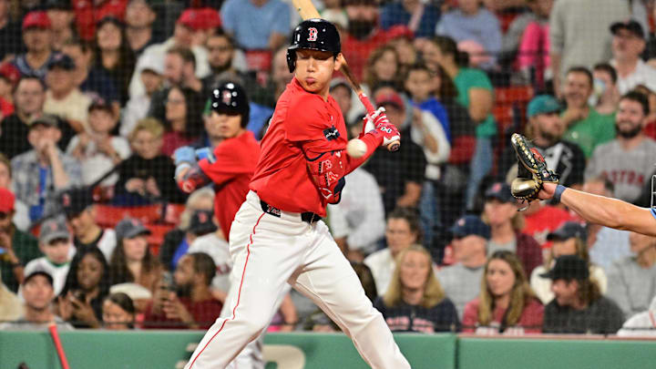  Boston Red Sox designated hitter Masataka Yoshida (7) gets hit by the pitch during second inning against the Tampa Bay Rays at Fenway Park on 2024.
