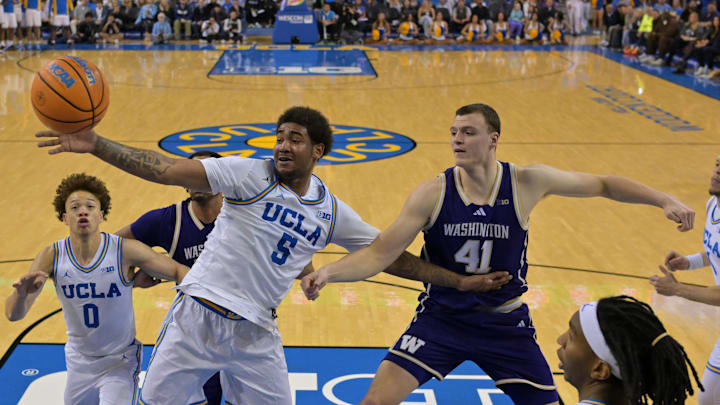 Feb 7, 2026; Los Angeles, California, USA; UCLA Bruins guard Brandon Williams (5) and Washington Huskies forward Jacob Ognacevic (41) go for a rebound in the second half at Pauley Pavilion presented by Wescom Financial. Mandatory Credit: Jayne Kamin-Oncea-Imagn Images