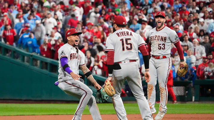 Diamondbacks second baseman Ketel Marte, third baseman Emmanuel Rivera and first baseman Christian Walker celebrate NL pennant.