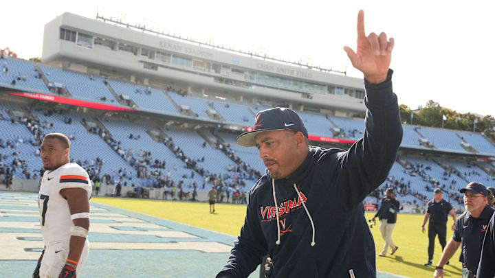 Oct 25, 2025; Chapel Hill, North Carolina, USA; Virginia Cavaliers head coach Tony Elliott runs off the field after defeating the North Carolina Tar Heels in overtime at Kenan Stadium. Mandatory Credit: Bob Donnan-Imagn Images