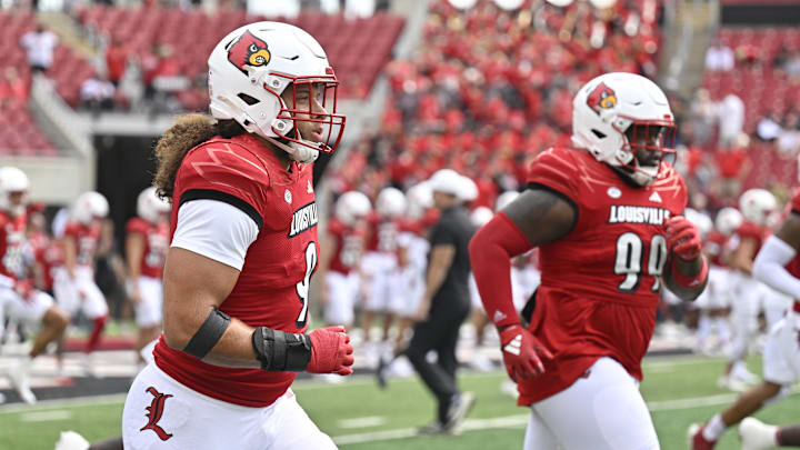 Aug 31, 2024; Louisville, Kentucky, USA;  Louisville Cardinals defensive lineman Ashton Gillotte (9) warms up before facing off against the Austin Peay Governors at L&N Federal Credit Union Stadium. Mandatory Credit: Jamie Rhodes-Imagn Images