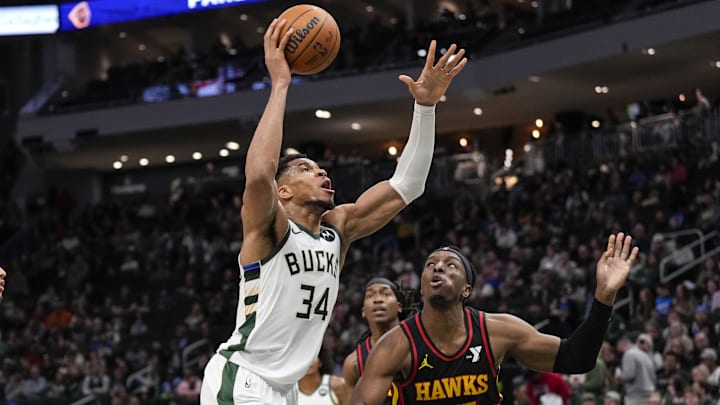 Mar 30, 2025; Milwaukee, Wisconsin, USA; Milwaukee Bucks forward Giannis Antetokounmpo (34) shoots over Atlanta Hawks center Onyeka Okongwu (17) during the second quarter at Fiserv Forum. Mandatory Credit: Jeff Hanisch-Imagn Images Mar 30, 2025; Milwaukee, Wisconsin, USA; Milwaukee Bucks forward Giannis Antetokounmpo (34) shoots over Atlanta Hawks center Onyeka Okongwu (17) during the second quarter at Fiserv Forum. Mandatory Credit: Jeff Hanisch-Imagn Images