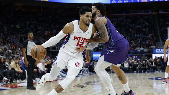 Detroit Pistons forward Tobias Harris (12) dribbles defended by Charlotte Hornets forward Miles Bridges 