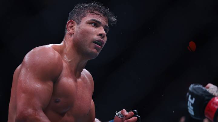 Apr 11, 2026; Miami, Florida, UNITED STATES;  Azamat Murzakanov (red gloves) fights Paulo Costa (blue gloves) during UFC 327 at Kaseya Center. Mandatory Credit: Sam Navarro-Imagn Images