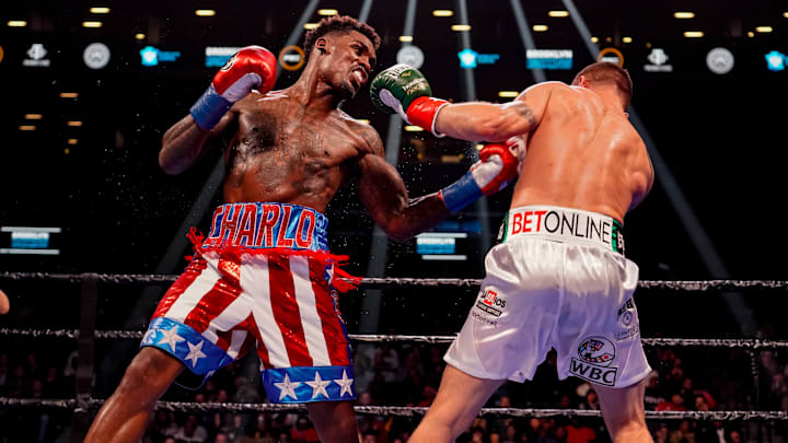 Jermall Charlo throws a left hook against Dennis Hogan.
