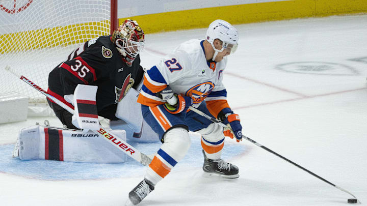 Oct 18, 2025; Ottawa, Ontario, CAN; New York Islanders left wing Anders Lee (27) skates unckecked with the puck in front of Ottawa Senators goalie Linus Ullmark (35) in the third period at the Canadian Tire Centre. Mandatory Credit: Marc DesRosiers-IMAGN Images