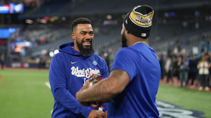 Oct 24, 2025; Toronto, Ontario, CAN; Toronto Blue Jays first baseman Vladimir Guerrero Jr. (27) greets Los Angeles Dodgers right fielder Teoscar Hernandez (37) during batting practice prior to game one of the 2025 MLB World Series at Rogers Centre. Mandatory Credit: Kevin Sousa-Imagn Images