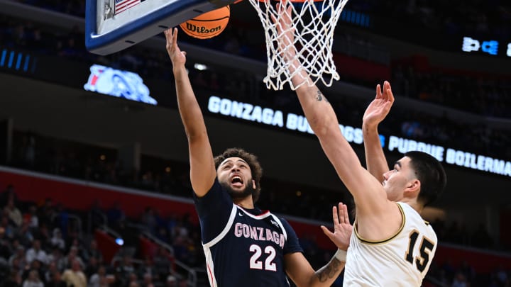 Mar 29, 2024; Detroit, MN, USA; Gonzaga Bulldogs forward Anton Watson (22) shoots the ball over Purdue Boilermakers center Zach Edey (15) in the second half during the NCAA Tournament Midwest Regional at Little Caesars Arena. Mandatory Credit: Lon Horwedel-USA TODAY Sports Mar 29, 2024; Detroit, MN, USA; Gonzaga Bulldogs forward Anton Watson (22) shoots the ball over Purdue Boilermakers center Zach Edey (15) in the second half during the NCAA Tournament Midwest Regional at Little Caesars Arena. Mandatory Credit: Lon Horwedel-USA TODAY Sports