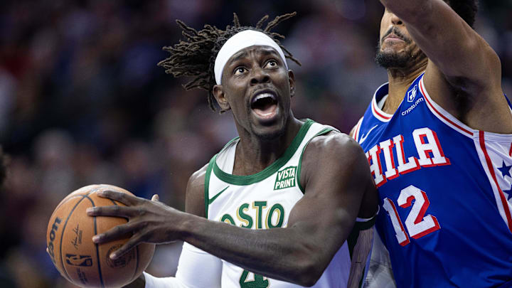 Nov 15, 2023; Philadelphia, Pennsylvania, USA; Boston Celtics guard Jrue Holiday (4) drives against Philadelphia 76ers forward Tobias Harris (12) during the first quarter at Wells Fargo Center. Mandatory Credit: Bill Streicher-Imagn Images