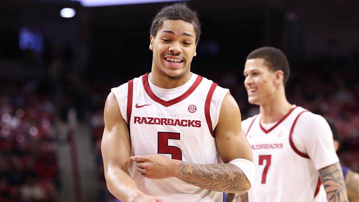 Dec 16, 2025; Fayetteville, Arkansas, USA; Arkansas Razorbacks guard Darius Acuff Jr (5) celebrates after a play against the Queens Royals during the second half at Bud Walton Arena. Arkansas won 108-80.