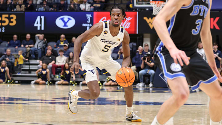 West Virginia University guard Toby Okani