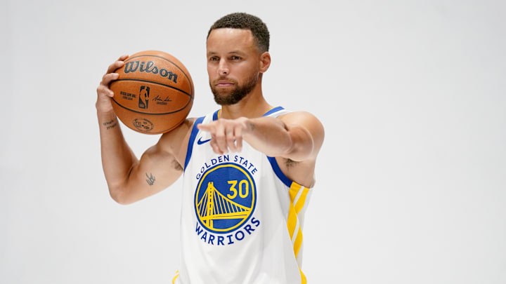Golden State Warriors guard Stephen Curry (30) holds onto the ball during Media Day at the Chase Center.