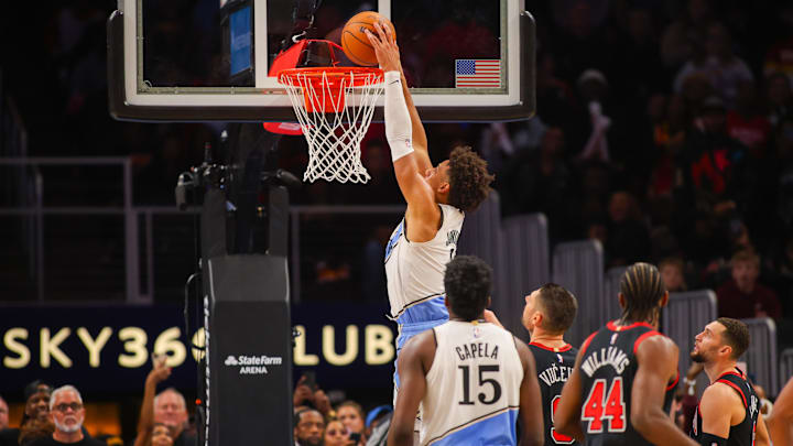 Dec 26, 2024; Atlanta, Georgia, USA; Atlanta Hawks forward Jalen Johnson (1) dunks against the Chicago Bulls in the fourth quarter at State Farm Arena. Mandatory Credit: Brett Davis-Imagn Images
