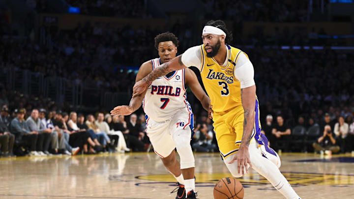 Nov 8, 2024; Los Angeles, California, USA; Los Angeles Lakers forward Anthony Davis (3) drives against Philadelphia 76ers guard Kyle Lowry (7) during the second half at Crypto.com Arena. Mandatory Credit: Jonathan Hui-Imagn Images