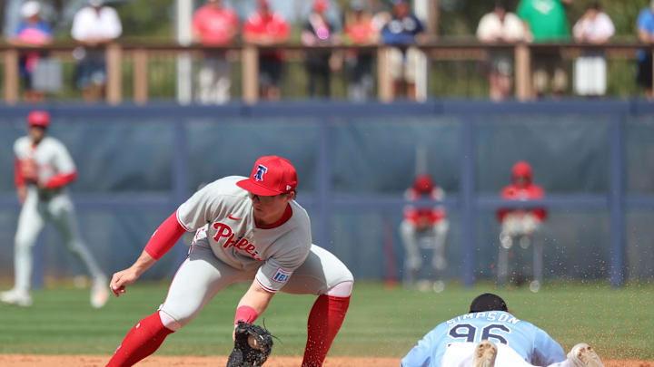 Tampa Bay Rays outfielder Chandler Simpson (96) slides safely into second base against Philadelphia Phillies infielder Aidan Miller (81) at Charlotte Sports Park. 