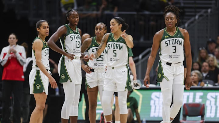 Jul 13, 2025; Seattle, Washington, USA; Seattle Storm guard Skylar Diggins (4), forward Ezi Magbegor (13), guard Tiffany Mitchell (25), forward Gabby Williams (5) and forward Nneka Ogwumike (3) talk following a fourth quarter  timeout against the Washington Mystics at Climate Pledge Arena. Mandatory Credit: Joe Nicholson-Imagn Images