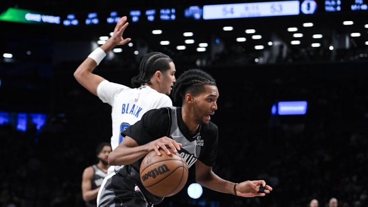 Dec 1, 2024; Brooklyn, New York, USA; Brooklyn Nets forward Ziaire Williams (1) drives to the basket while being defended by Orlando Magic guard Anthony Black (0) during the second half at Barclays Center. Mandatory Credit: John Jones-Imagn Images