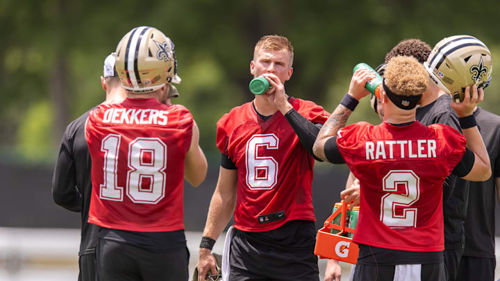 Jun 10, 2025; New Orleans, LA, USA;  New Orleans Saints quarterback Tyler Shough (6) and quarterback Spencer Rattler (2) and quarterback Hunter Dekkers (18) take a water break during minicamp at Ochsner Sports Performance Center. Mandatory Credit: Stephen Lew-Imagn Images