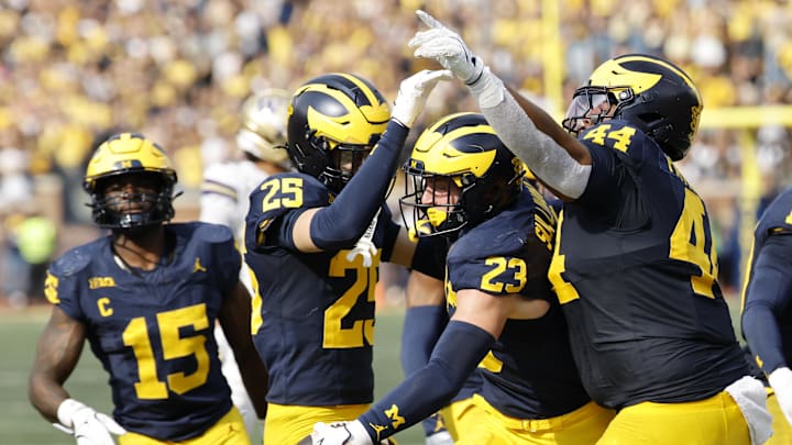 Oct 18, 2025; Ann Arbor, Michigan, USA;  Michigan Wolverines linebacker Cole Sullivan (23) celebrates after he makes an interception in the second half at Michigan Stadium. Mandatory Credit: Rick Osentoski-Imagn Images