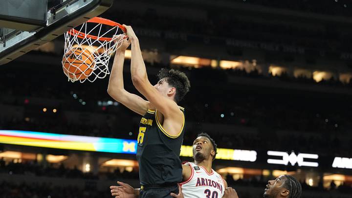 Apr 4, 2026; Indianapolis, IN, USA; Michigan Wolverines center Aday Mara (15) dunks against the Arizona Wildcats in the first half during a semifinal of the Final Four of the men's 2026 NCAA Tournament at Lucas Oil Stadium. Mandatory Credit: Robert Deutsch-Imagn Images Apr 4, 2026; Indianapolis, IN, USA; Michigan Wolverines center Aday Mara (15) dunks against the Arizona Wildcats in the first half during a semifinal of the Final Four of the men's 2026 NCAA Tournament at Lucas Oil Stadium. Mandatory Credit: Robert Deutsch-Imagn Images