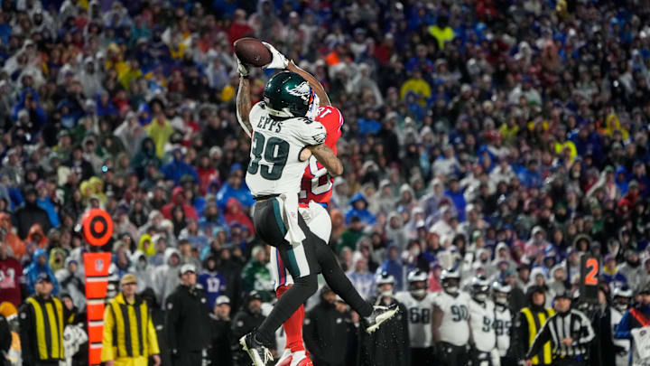 Dec 28, 2025; Orchard Park, New York, USA; Buffalo Bills wide receiver Brandin Cooks (18) (obscured) leaps to catch a pass against Philadelphia Eagles safety Marcus Epps (39) during the fourth quarter at Highmark Stadium. Mandatory Credit: Gregory Fisher-Imagn Images