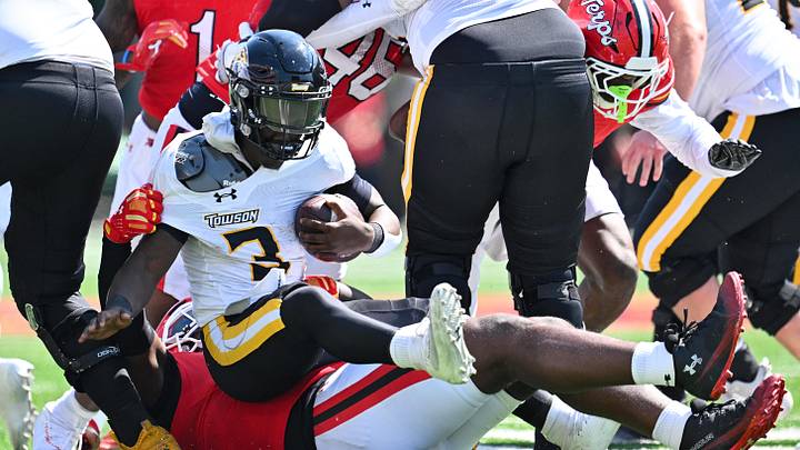 Sep 13, 2025; College Park, Maryland, USA; Towson Tigers running back Kemarrion Battles (3) is hauled down for no gain by Maryland Terrapins defensive lineman Bryce Jenkins (57) in the second half at SECU Stadium. Mandatory Credit: Jamie Sabau-Imagn Images Sep 13, 2025; College Park, Maryland, USA; Towson Tigers running back Kemarrion Battles (3) is hauled down for no gain by Maryland Terrapins defensive lineman Bryce Jenkins (57) in the second half at SECU Stadium. Mandatory Credit: Jamie Sabau-Imagn Images