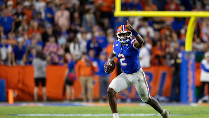 Oct 19, 2024; Gainesville, Florida, USA; Florida Gators quarterback DJ Lagway (2) gestures while running with the ball against the Kentucky Wildcats during the second half at Ben Hill Griffin Stadium. Mandatory Credit: Matt Pendleton-Imagn Images