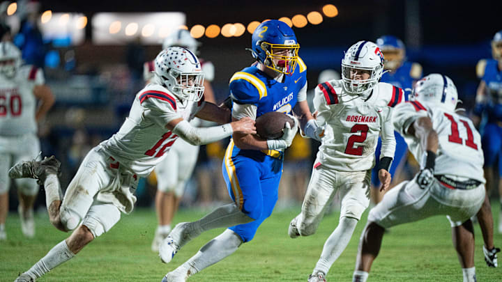 DCA's Carson Sneed (2) runs after a catch as Tipton-Rosemark's Tanner Thornell (12) tries to tackle him during their Division II-A playoff game at Donelson Christian Academy in Nashville, Tenn., Friday, Nov. 8, 2024.