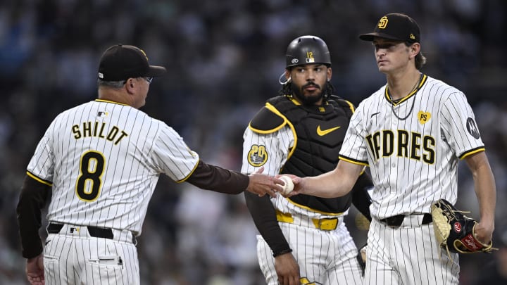 Jun 20, 2024; San Diego, California, USA; San Diego Padres manager Mike Shildt (8) takes the ball from starting pitcher Adam Mazur (right) during a pitching change in the fifth inning against the Milwaukee Brewers at Petco Park. Mandatory Credit: Orlando Ramirez-USA TODAY Sports