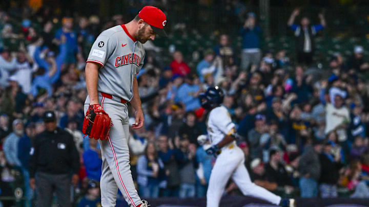 Apr 6, 2025; Milwaukee, Wisconsin, USA;  Cincinnati Reds pitcher Sam Moll (50) reacts after giving up a 3-run home run to Milwaukee Brewers left fielder Jackson Chourio (11) in the fourth inning at American Family Field. Mandatory Credit: Benny Sieu-Imagn Images