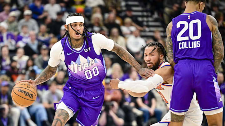 Nov 23, 2024; Salt Lake City, Utah, USA; Utah Jazz guard Jordan Clarkson (00) dribbles the ball against New York Knicks guard Jalen Brunson (11) after a screen by Utah forward/center John Collins (20) during the second half at the Delta Center. Mandatory Credit: Christopher Creveling-Imagn Images Nov 23, 2024; Salt Lake City, Utah, USA; Utah Jazz guard Jordan Clarkson (00) dribbles the ball against New York Knicks guard Jalen Brunson (11) after a screen by Utah forward/center John Collins (20) during the second half at the Delta Center. Mandatory Credit: Christopher Creveling-Imagn Images